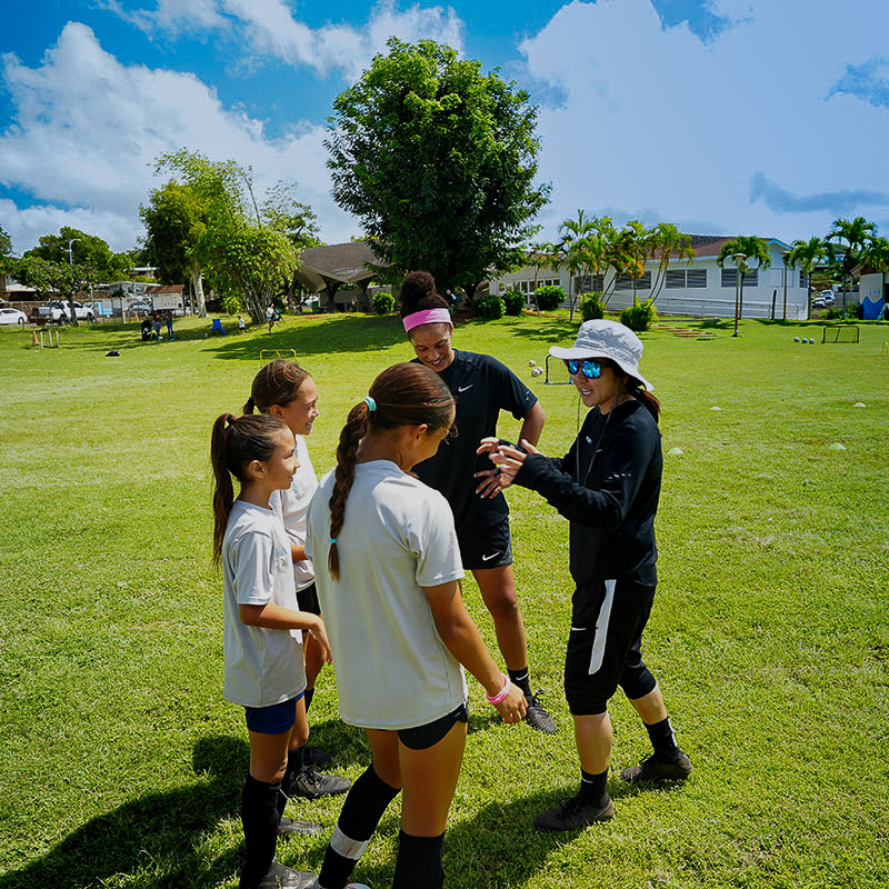 image of Erin Otagaki, Parrissa Eyorokon, and students of Rise Soccer Training Academy